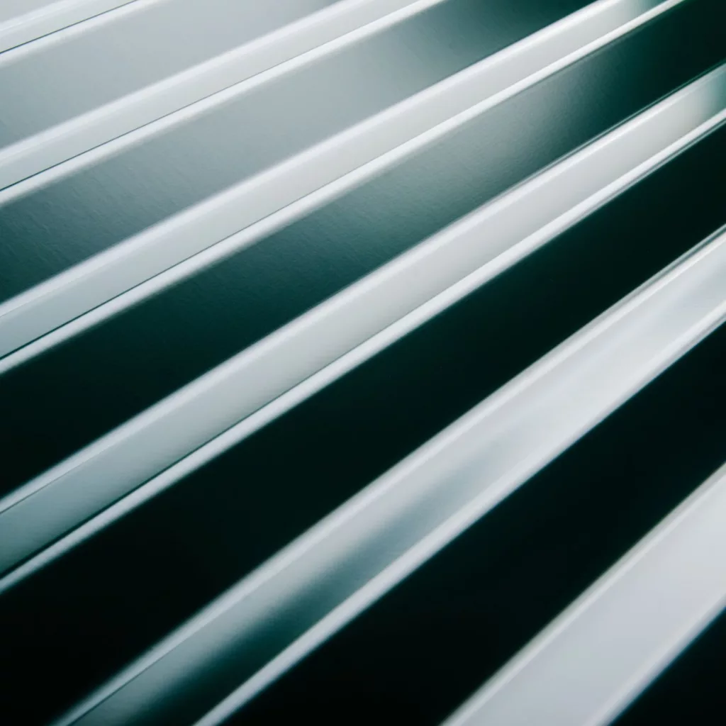 What is flashing on a roof?

Flashing is a flat, thin material used to keep water out of the openings and cracks in a roof. It is installed beneath your roof's shingles and redirects water to another location.
